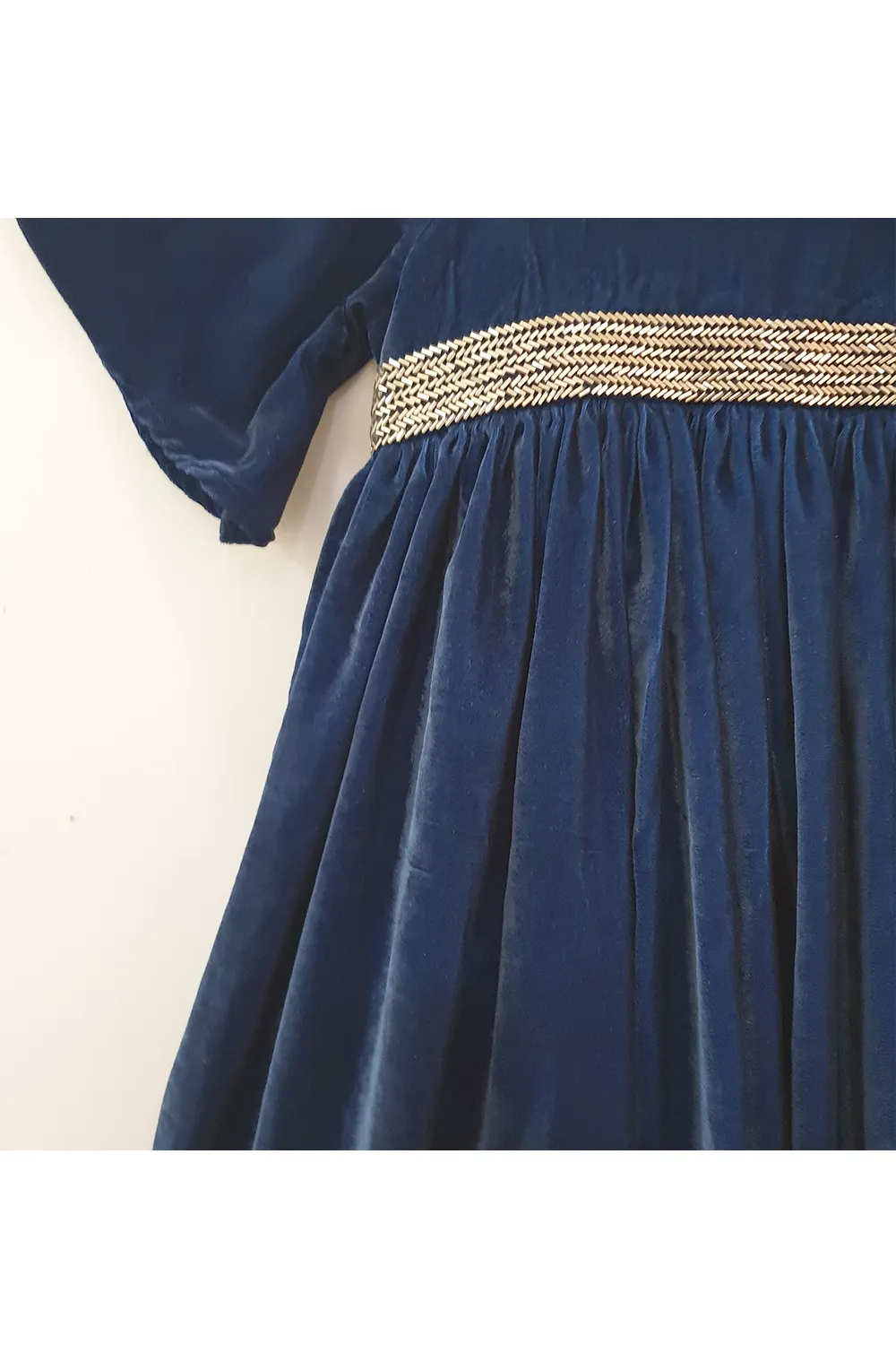 Navy blue velvet gown with cut dana embroidered waist